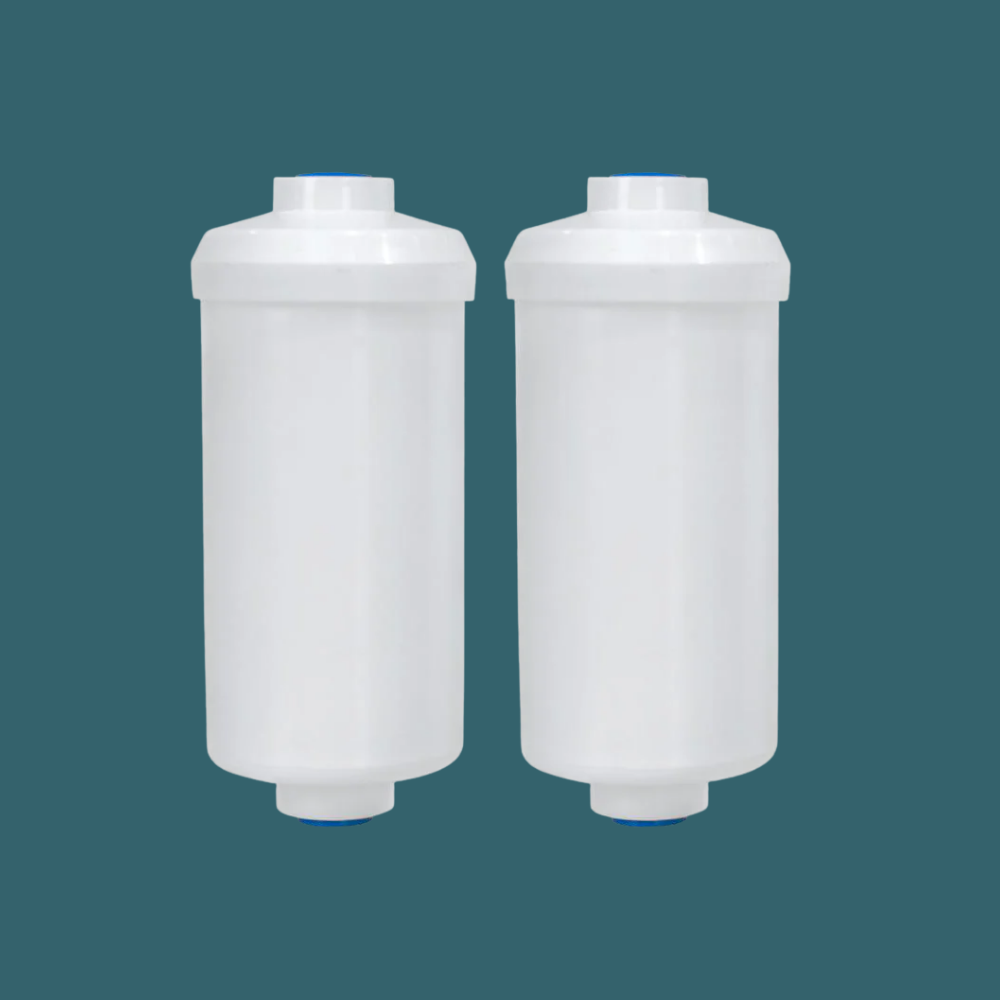 Two white cylindrical filters on a teal background