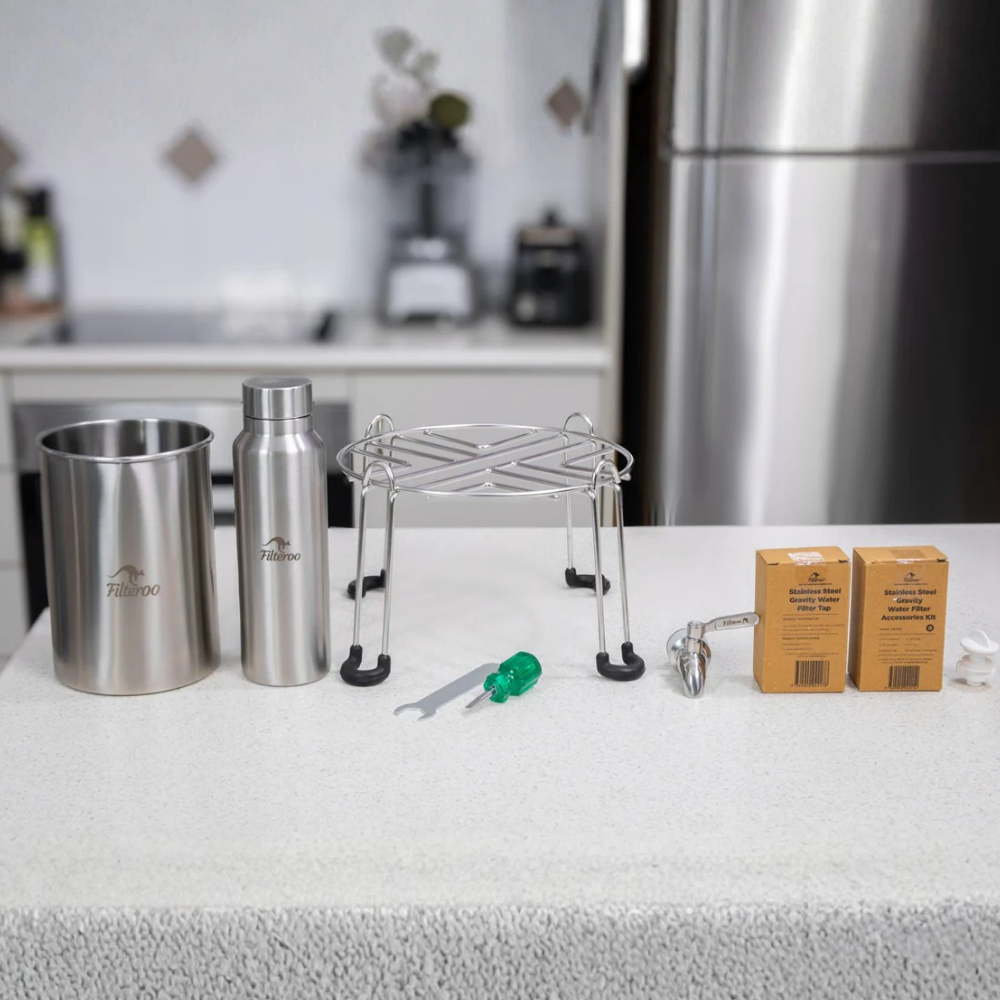 Filteroo® Superoo Stainless Steel Fluoride Filter System Accesorries on a countertop with a blurred kitchen background