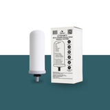 Ceramic gravity water filter with packaging on a white and green gradient background
