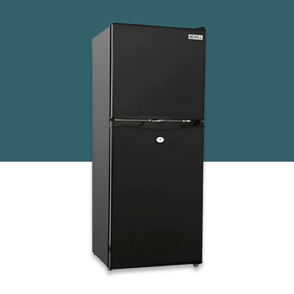 Black refrigerator against a teal and white background