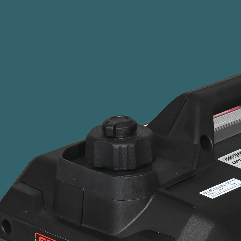 Close-up of a black power tool on a teal background