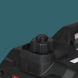 Close-up of a black power tool on a teal background