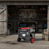 Power generator in front of a workshop with tools and equipment.