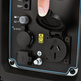 Close-up of a power outlet with a finger pressing a button on a black device.
