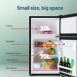 Small refrigerator with labeled compartments on a light green background