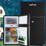 Black refrigerator with open door showing food items against a scenic background