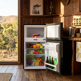 Black refrigerator with open doors displaying food items in a rustic kitchen.