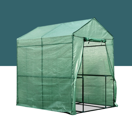 Green portable greenhouse on a white background