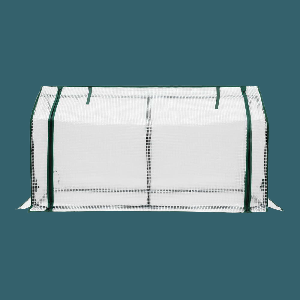 White mesh bag with green straps on a teal background