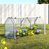 Greenhouse with plants and flowers in a garden setting