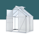White greenhouse with transparent panels on a white background