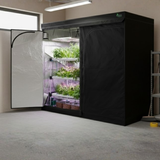 Various Green Fingers grow tents feature reflective interiors, LED lighting, and lush indoor plants.