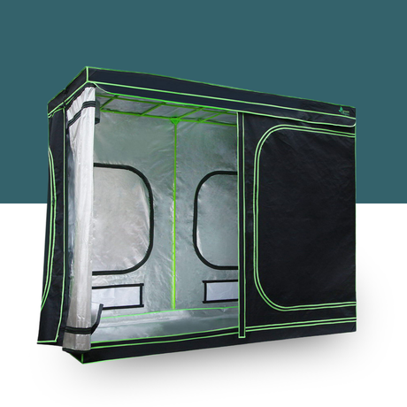 Black and green grow tent with transparent side panels on a white background