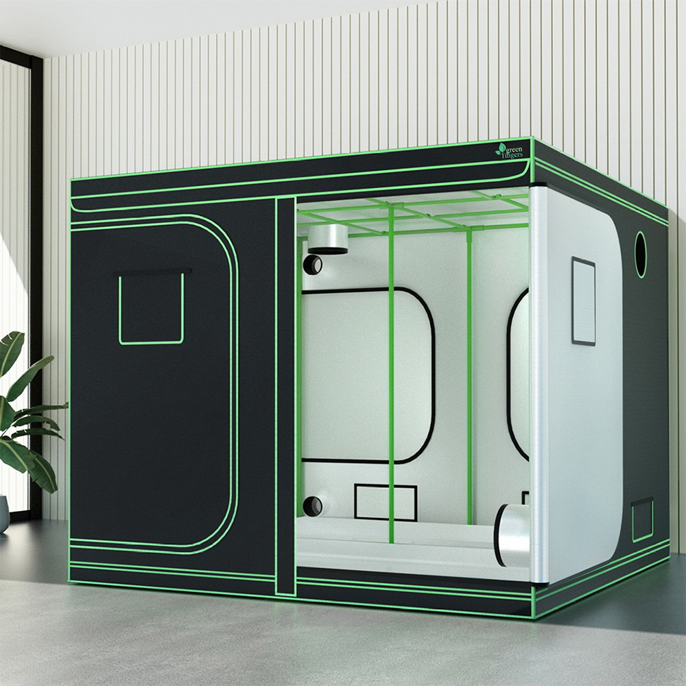 Modern shower cabin with green accents in a room setting