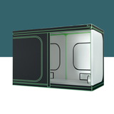 Large black indoor grow tent with green piping, open side panel showing white reflective interior and support frame.