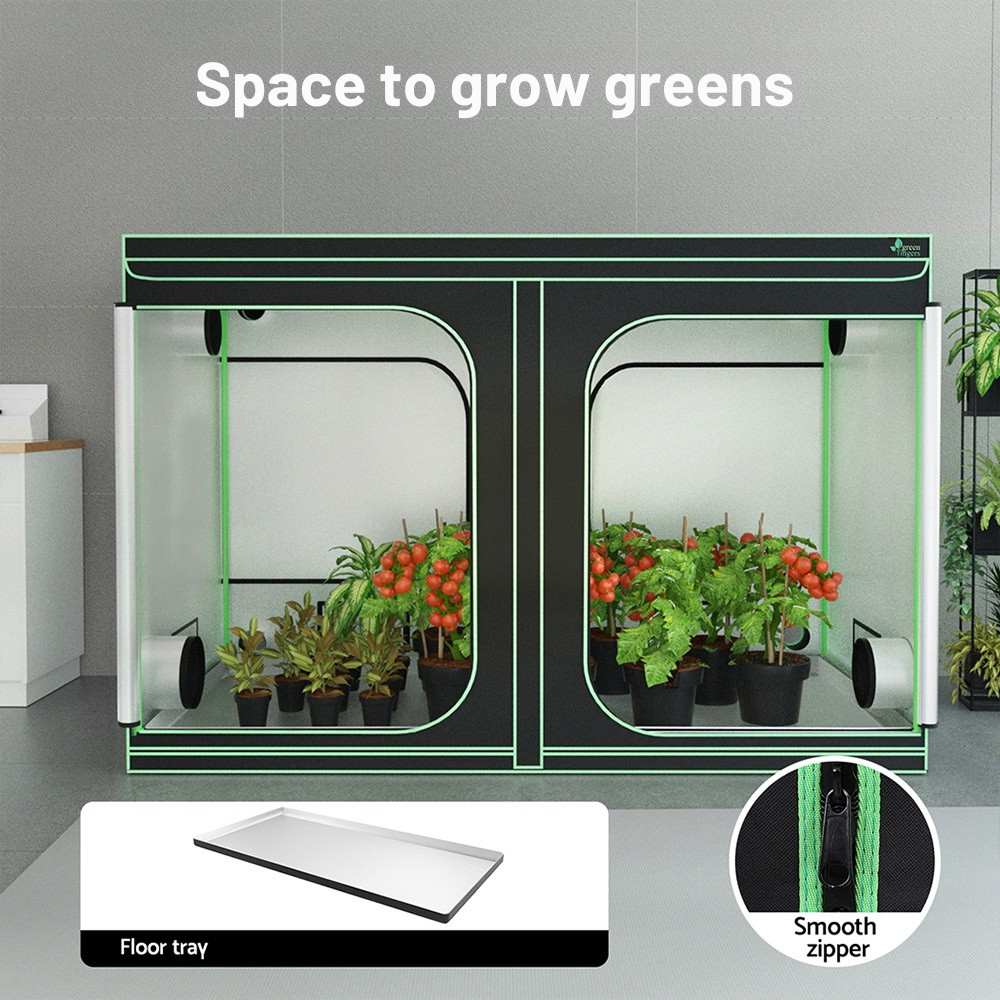 Small indoor gardening system with plants and accessories on a gray background