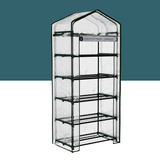 "A portable, multi-tiered greenhouse with a clear cover and sturdy metal frame, designed for protecting and nurturing plants indoors."