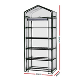 Dimensions of a small, portable greenhouse with multiple wire shelves and a clear cover, ideal for compact spaces and plant protection."