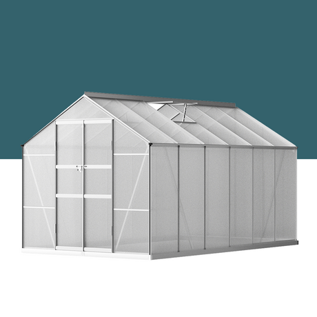 A sleek aluminium greenhouse with double doors and translucent panels, set against a neutral teal background. The structure appears sturdy and modern, designed for optimal light penetration