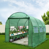 Displays the greenhouse in a garden setting, labelled "greenfingers-3-x-2-x-2m-steel-tunnel-walk-in-greenhouse-1". It is filled with plants, showcasing its usability for gardening.