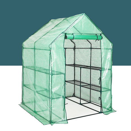 A compact green greenhouse with PE cover and front zipper door, showcasing a metal frame and multiple shelves inside