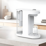 Stylish hot water dispenser in a modern kitchen setting, pouring water into a glass