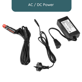 AC/DC power adapter with cables on a white background