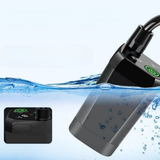Black electronic device with water droplets on a light blue background