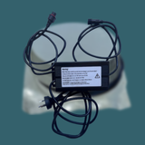 Power adapter with multiple cables on a blurred background
