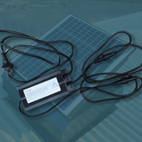 Power adapter with cables on a reflective surface