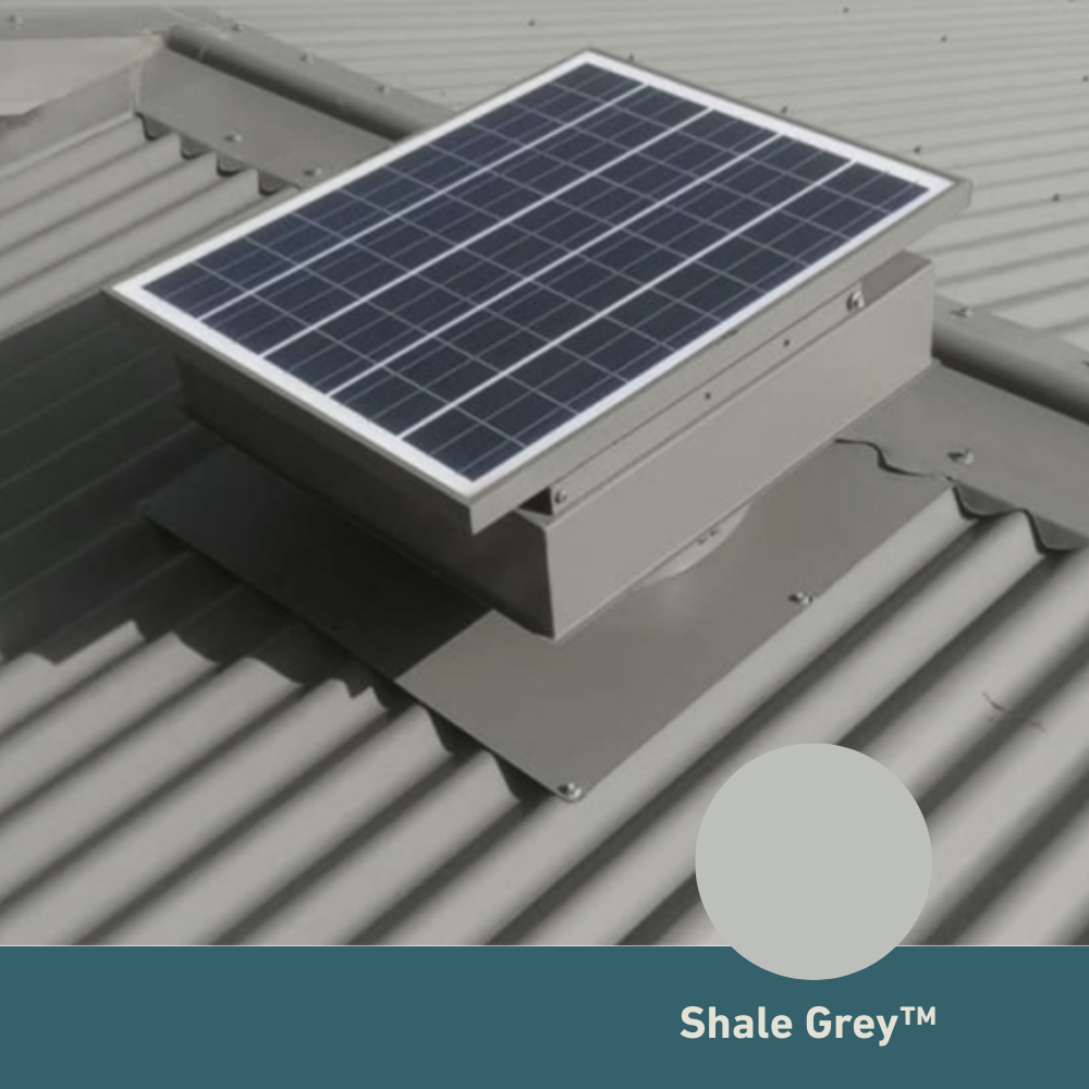 Square, solar-powered roof ventilator unit in Shale Grey installed on a corrugated metal roof.