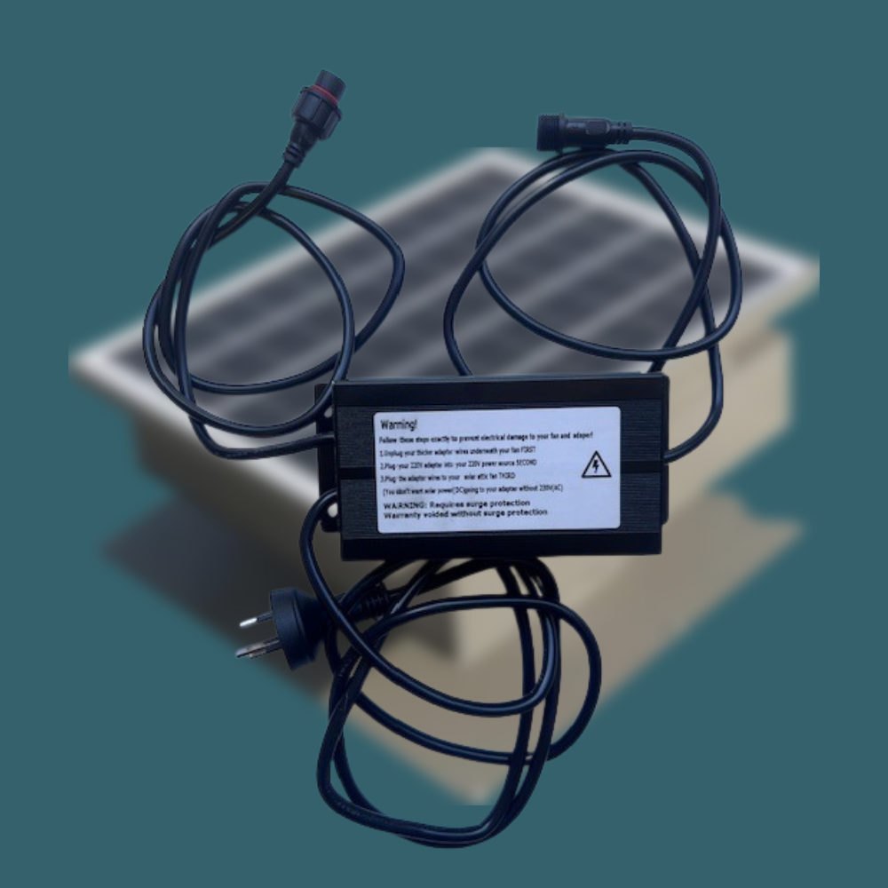 A black power adapter unit is shown with cables, featuring a warning label about connection order and surge protection requirements.