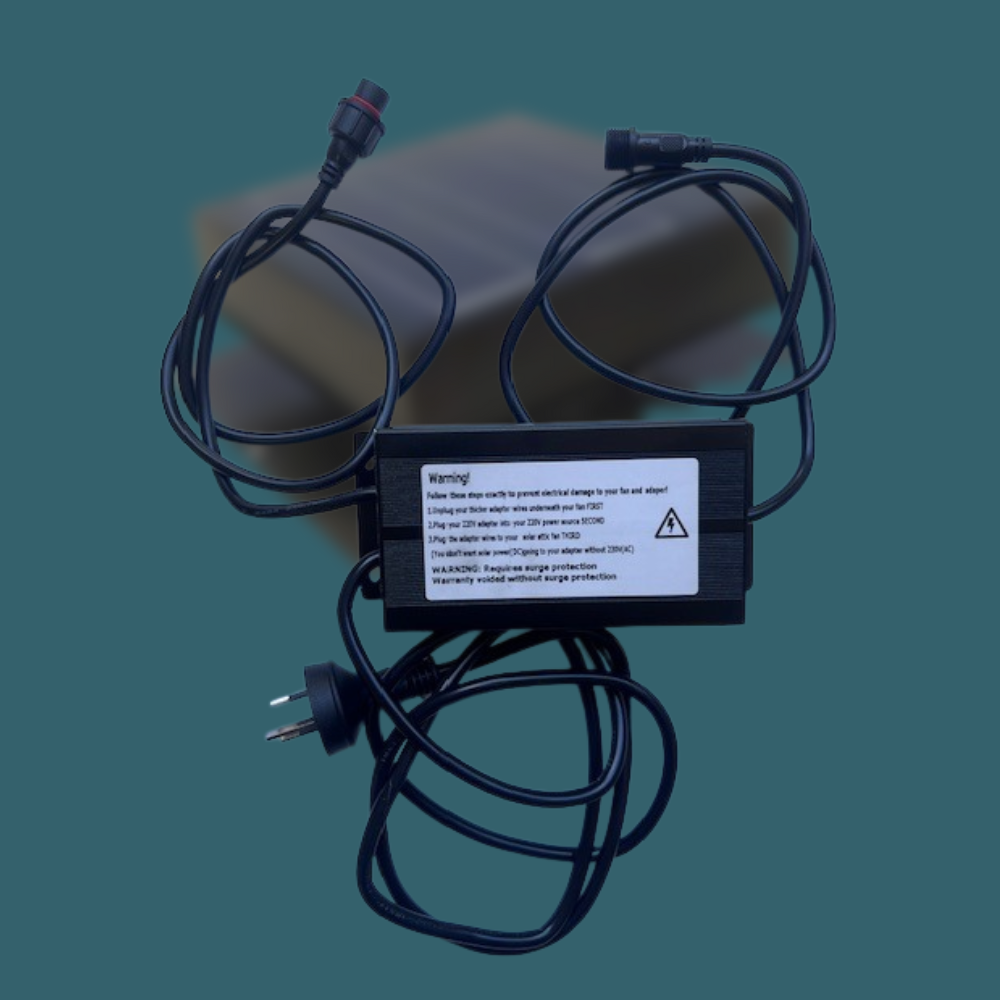 Power adapter with multiple cables on a dark background