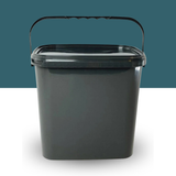 Trelino® Composting Toilet Solid Waste Container With Lid - Black on a white surface with a teal background