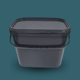 Trelino® Composting Toilet Solid Waste Container With Lid - Black on a dark green background