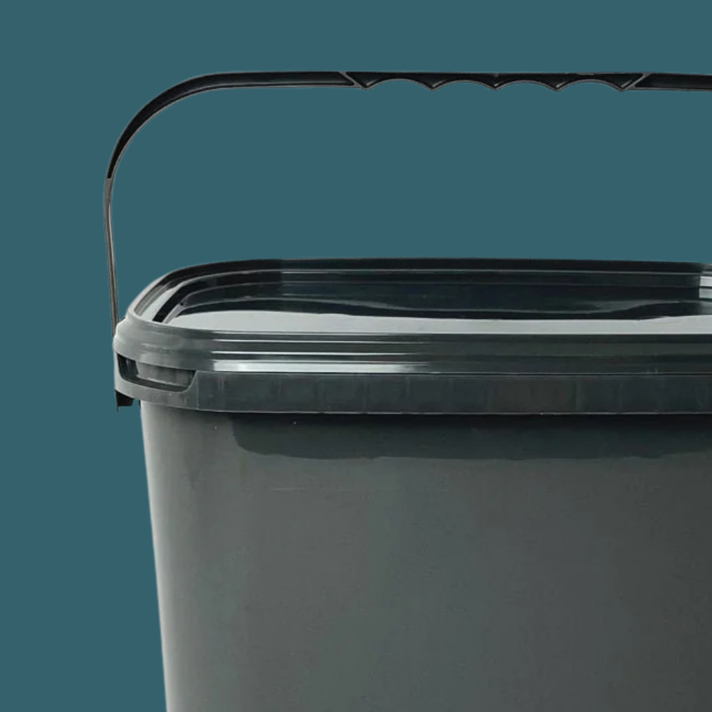 Close up shot of Trelino® Composting Toilet Solid Waste Container With Lid - Black on a dark blue background