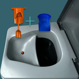 Close-up of a sink with an orange faucet and blue cup on a teal background