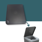 A dark charcoal gray square lid with a small white plant icon, shown above an open matching gray container with a teal arrow pointing from the closed lid to the open container, on a split teal and white background.