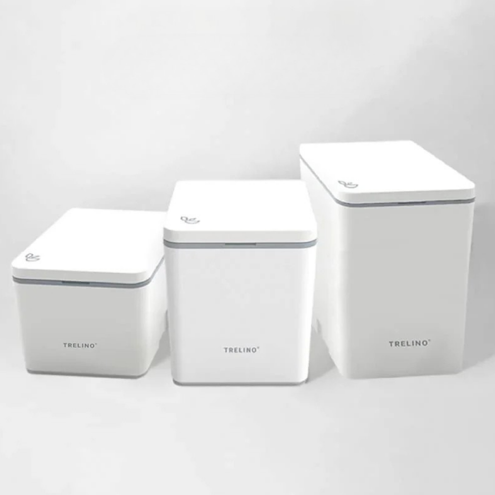 Three white portable toilet with lids on a light gray background