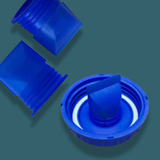 Blue plastic components on a teal background