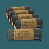 Multiple rolls of Trelino recycling bags on a teal background