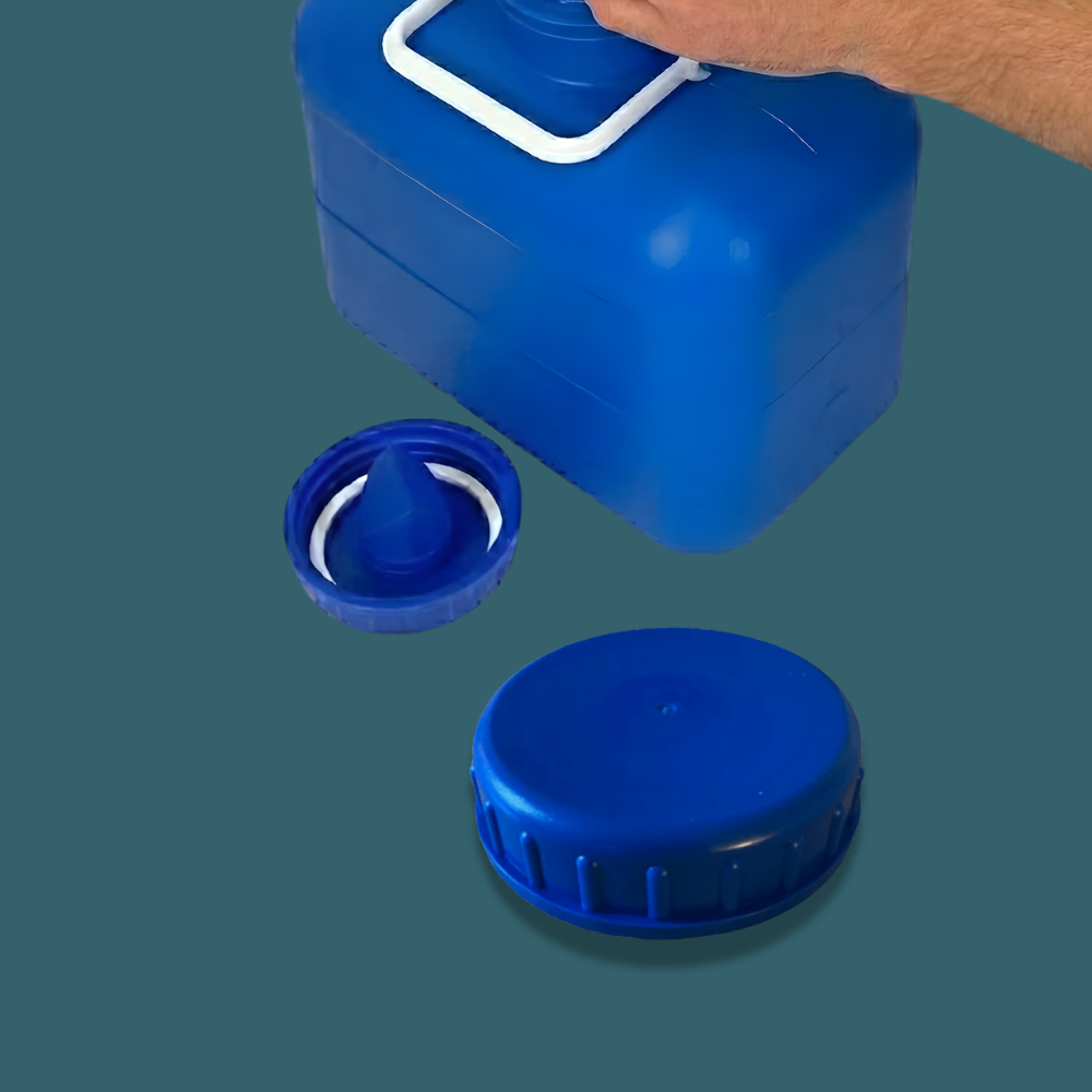 Blue plastic container with two lids on a green background