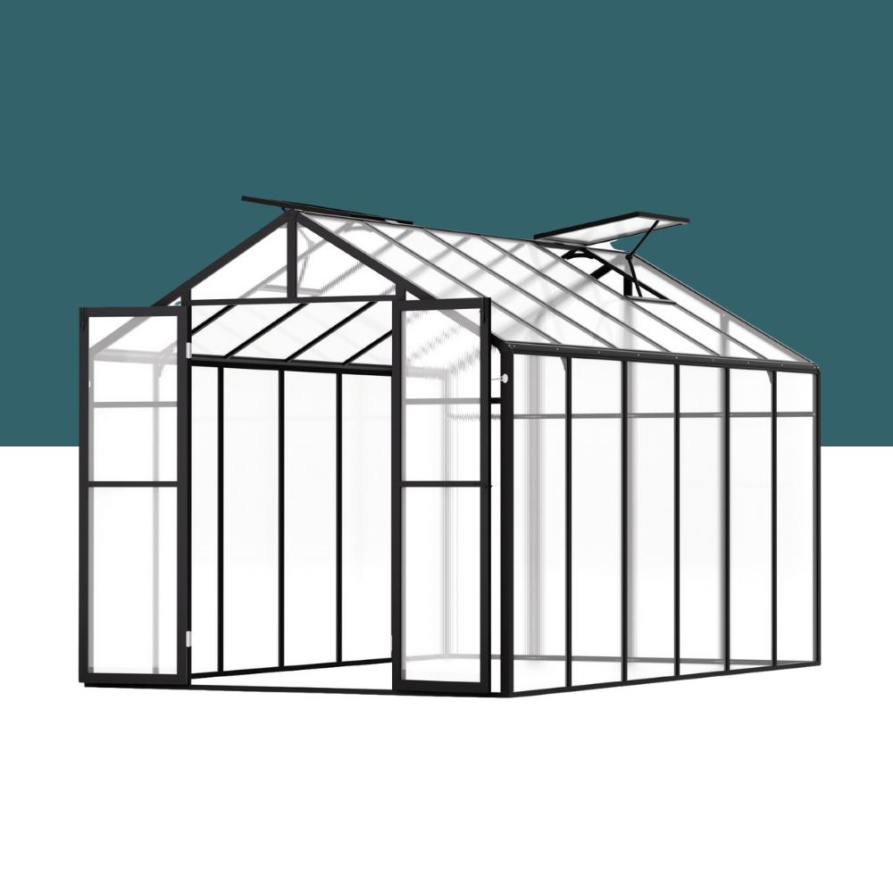 Greenhouse structure with glass panels and metal frame on a white background