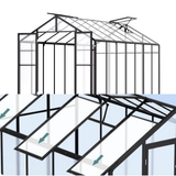 Glass greenhouse structure with metal frame on a white background