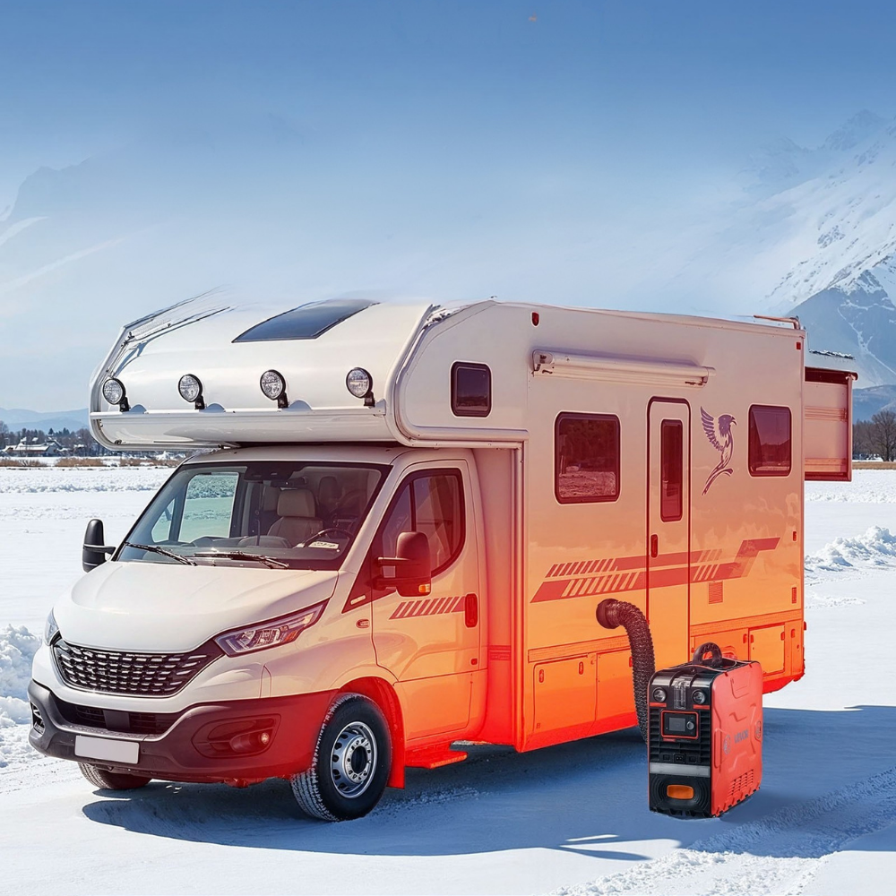 White and orange RV parked in a snowy landscape with mountains in the background