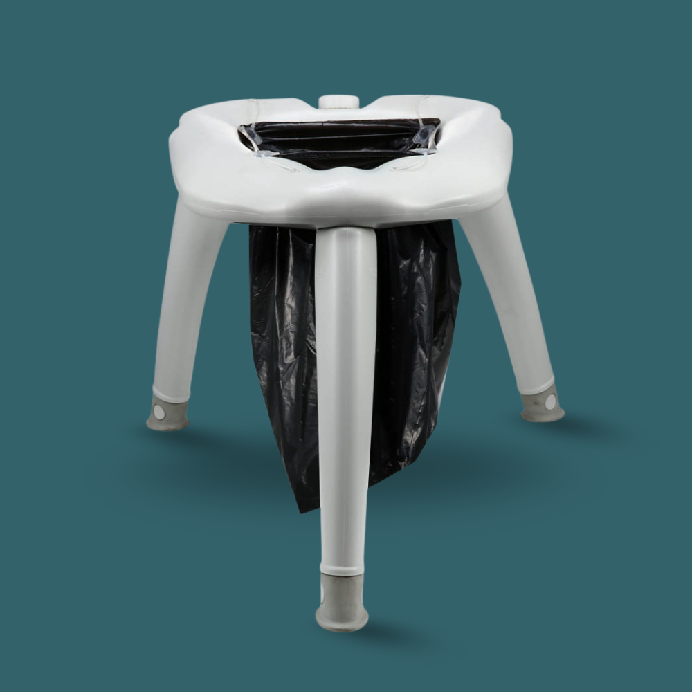 White plastic stool with a black trash bag underneath on a teal background