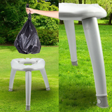 White plastic stool with a black trash bag, white plastic leg extension on grass